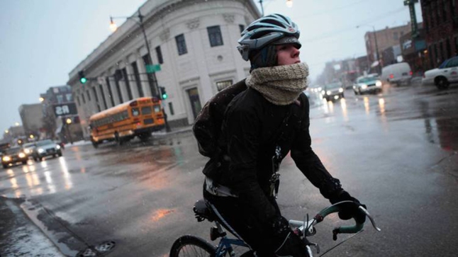 A biker makes her way through the snow along Damen Avenue in the Wicker Park neighborhood of Chicago.